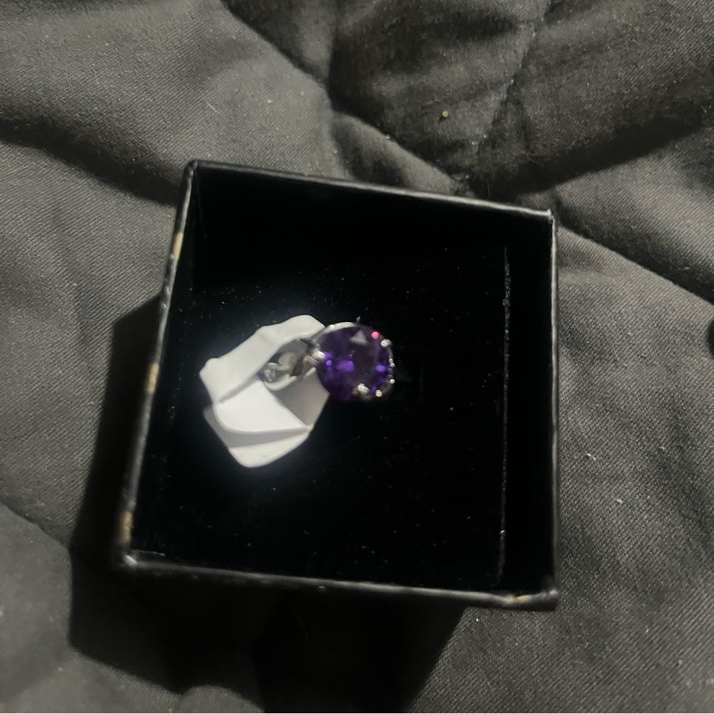 Women’s size 9 ring with amethyst colored gemstone